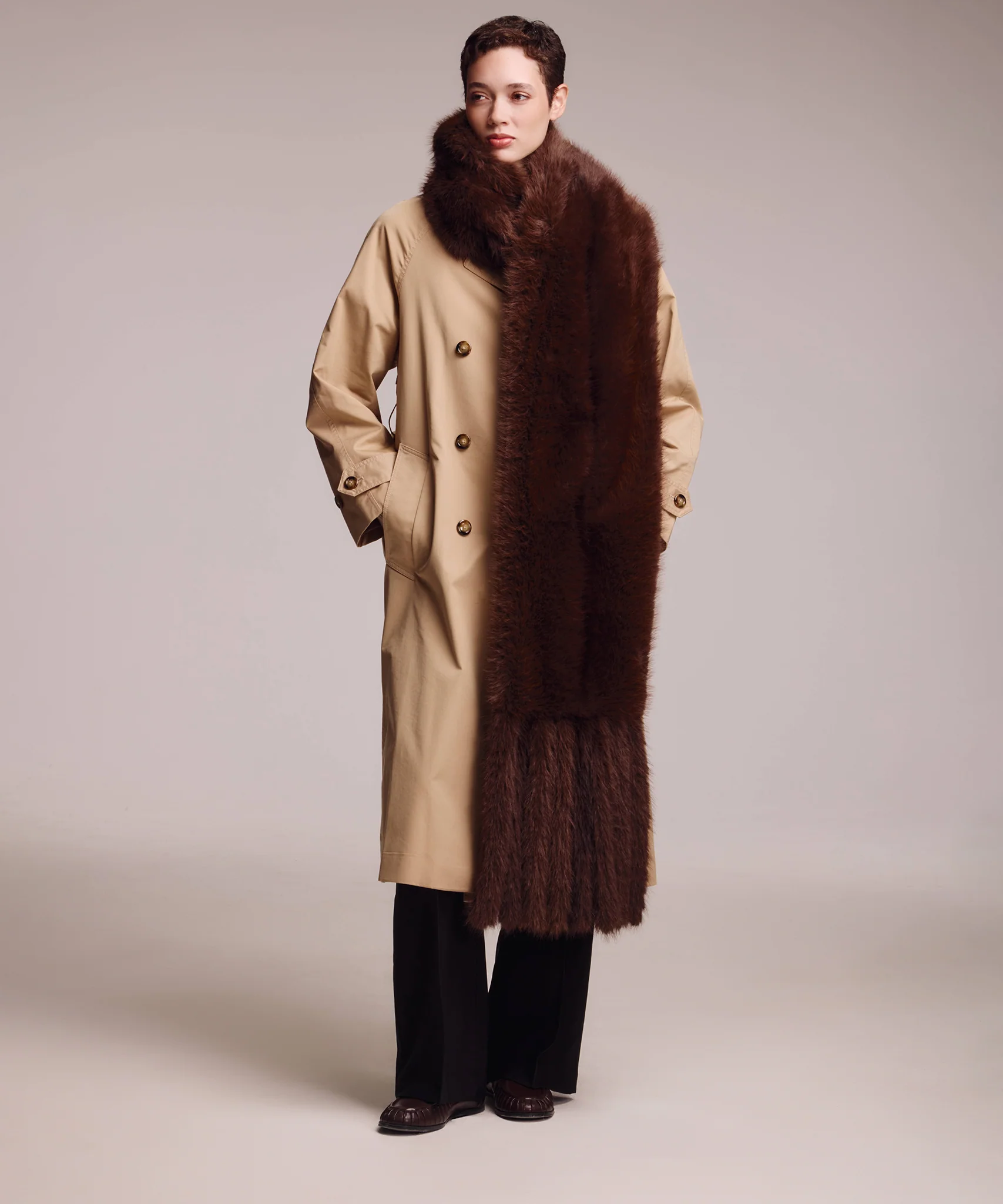 Echo New York brown faux fur stole styled over a beige coat