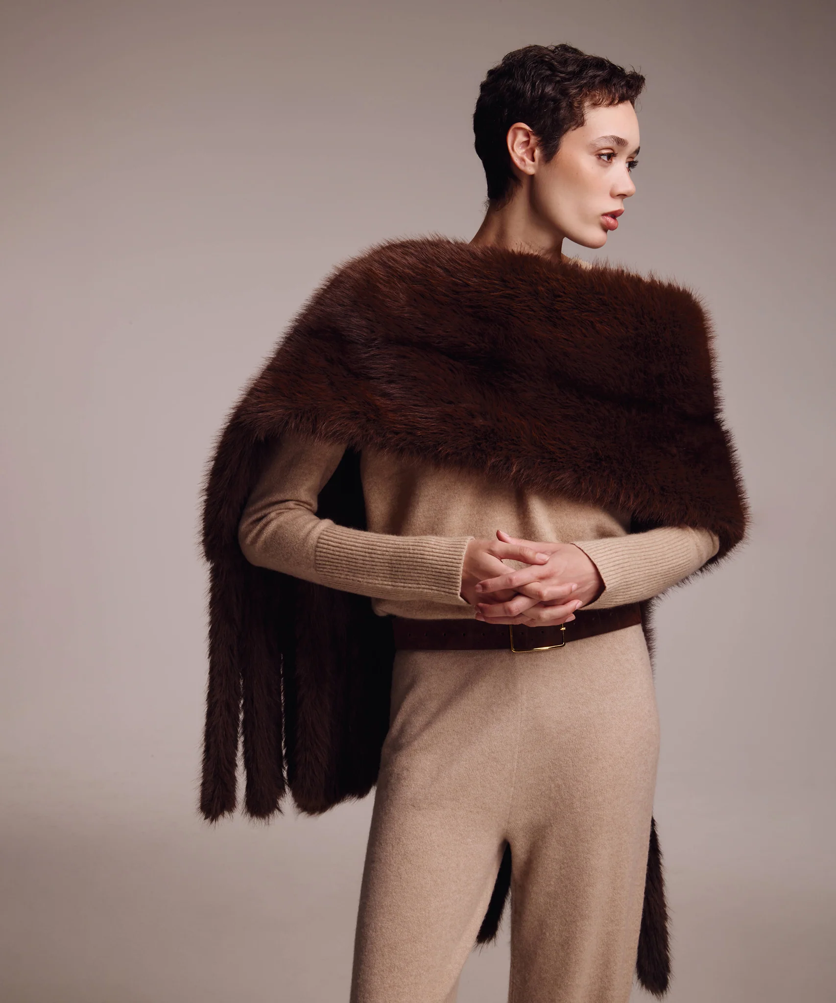 Echo New York brown faux fur stole draped over a camel outfit