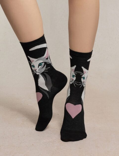 Feet wearing socks with cats