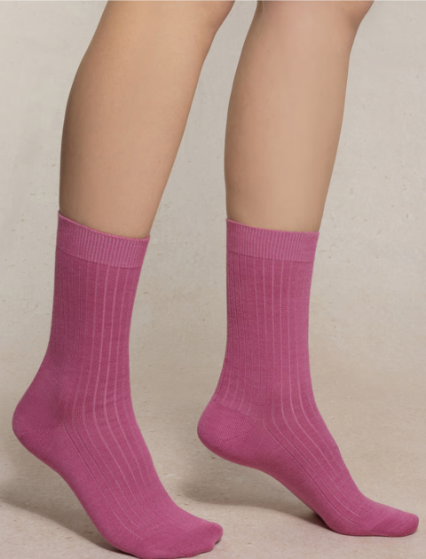 Feet wearing pink socks