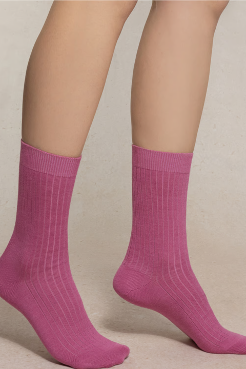 Feet wearing pink socks